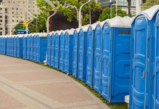 a row of portable restrooms ready for eventgoers in Charlestown, MA